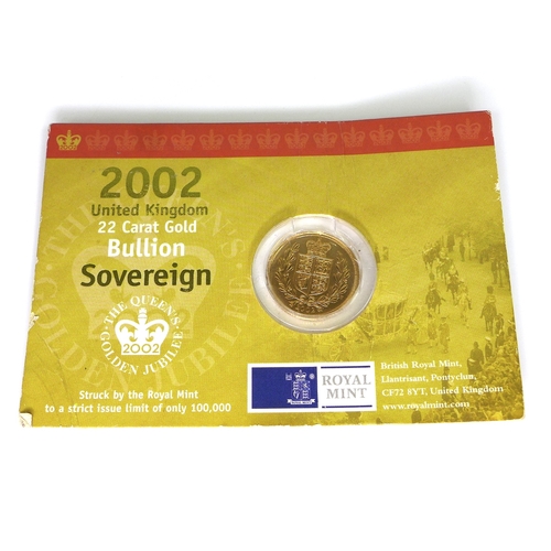 57 - An Elizabeth II gold shield back sovereign, 2002, in original card packaging.