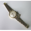 A 9ct gold Rotary lady's wristwatch, circa 1970, circular silvered dial with gold batons, gold and b... 