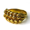 An 18ct gold keepers ring, of heavy knotted form, size U, 16.3g.