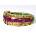 An 18ct gold 'night and day' swivel ring, the central eternity band set to one half with emeralds an... 