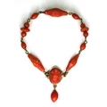 A Georgian or early Victorian gold and coral bracelet, the bracelet formed of variously shaped carve... 