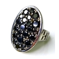 A Hendrikka Waage silver cocktail ring, the crown inset with twenty two faceted black stones, size P... 