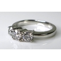 A 14ct white gold and diamond three stone ring, the brilliant cut stones totalling approximately 1ct... 