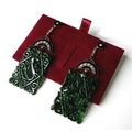 A pair of modern jade and diamond earrings, formed as rectangular carved jade panels suspended from ... 