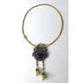 An amethyst, pearl and diamond necklace, formed as an amethyst cabochon surrounded by diamonds and s... 