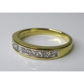 An 18ct gold half eternity ring, set with ten princess cut diamonds totalling approximately 0.6ct, s... 