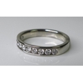 A platinum and diamond half eternity ring, set with eleven brilliant cut stones, approximately 0.4ct... 