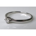 A platinum and diamond solitaire ring, the central brilliant cut stone of approximately 0.13ct, size... 