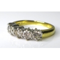 An 18ct yellow and white gold diamond five stone ring, each brilliant cut stone approximately 0.2ct,... 