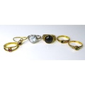A group of six 18ct gold rings, including examples set with ruby, sapphire and peridot, all size K/L... 