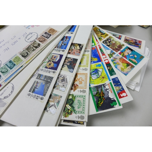 46 - A collection of over seventy first day covers, mostly GB, and seventeen presentation packs and loose... 