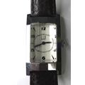A Dunhill lady's stainless steel tank watch, circa 2000, with faceted glass, white rectangular dial,... 