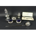 An assortment of silver items, comprising an early 20th century sugar sifter by Gorham Manufacturing... 