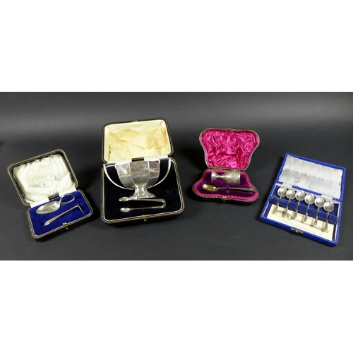 18 - A group of four cased silver Christening sets, including a twin handled sugar bowl, 1922 and tongs, ... 