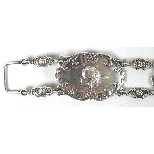 39 - An Edward VII silver christening belt, formed of nine oval plaques each cast in relief with Reynold'... 