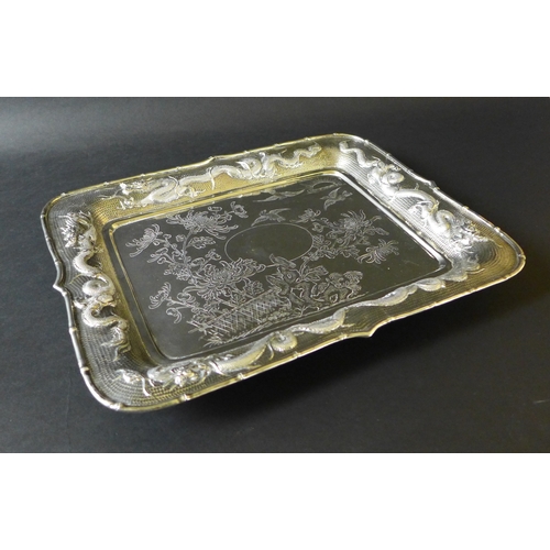 32 - A Chinese export silver tray, late 19th century, of rectangular form, with central engraved decorati... 