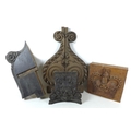 A group of antique wooden carvings, comprising a 19th century pine pew end with a carved Tudor rose,... 