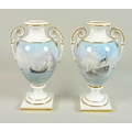 A pair of modern Royal Worcester pedestal vases, twin foliate scrolled handles, one decorated with a... 