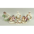 A group of six Victorian Staffordshire figurines, comprising a sleeping shepherd, 15cm high, a pair ... 
