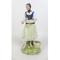 An early 19th century Meissen porcelain figurine, modelled as a fisherwoman 'Fischerin', after the m... 