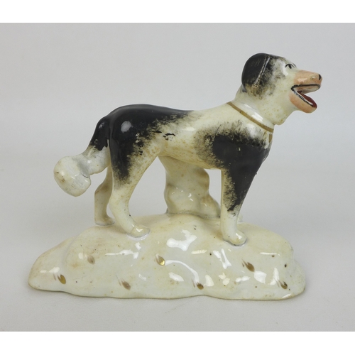 4 - Two Staffordshire figurines, mid 19th century, each modelled as a spaniel, one brown and white in se... 