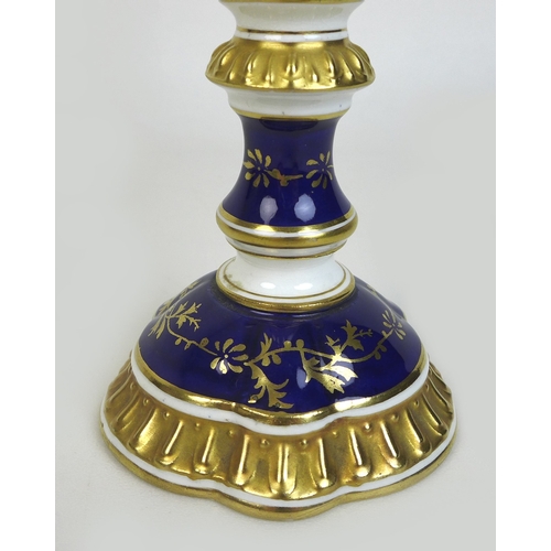 30 - An Edwardian Coalport porcelain goblet-vase, shape 144, modelled with three handles, flared rim, on ... 
