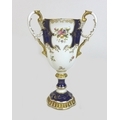 An Edwardian Coalport porcelain goblet-vase, shape 144, modelled with three handles, flared rim, on ... 