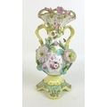 An early 19th century porcelain vase, of baluster form with pierced rim and shaped pedestal base, a ... 
