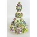 A 19th century porcelain perfume bottle and stopper, possibly Coalport, of squat baluster form, deco... 