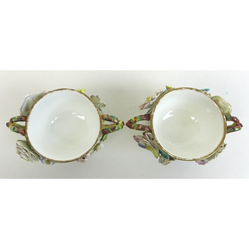 46 - A pair of 19th century porcelain encrusted polychrome twin handled bowls and covers, circa 1835, pro... 