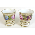 A pair of mid 19th century porcelain spill vases and loose bases, possibly Colaport, decorated with ... 