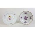 Two early 19th century Berlin factory porcelain dishes, one with frilled moulded rim, decorated with... 