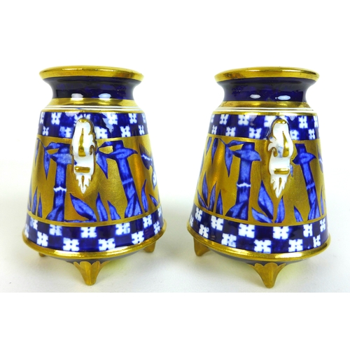 27 - A pair of Edwardian Coalport miniature vases, of baluster form with twin foliate clasped handles, de... 