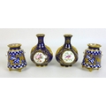 A pair of Edwardian Coalport miniature vases, of baluster form with twin foliate clasped handles, de... 