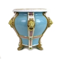 A Minton Majolica jardiniere, late 19th century, decorated with six applied lion masks with rings in... 