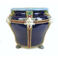 A majolica jardiniere in Minton style, late 20th century, decorated with six applied devil's masks w... 