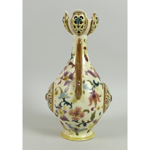 41 - A Zsolnay Pecs reticulated porcelain twin handled vase, circa 1885, of baluster form with reticulate... 