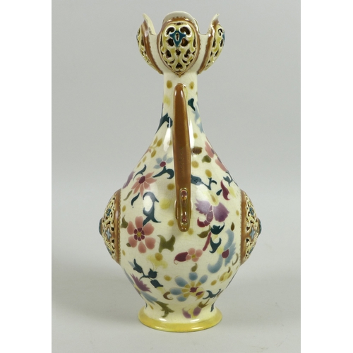 41 - A Zsolnay Pecs reticulated porcelain twin handled vase, circa 1885, of baluster form with reticulate... 