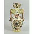 A Zsolnay Pecs reticulated porcelain twin handled vase, circa 1885, of baluster form with reticulate... 