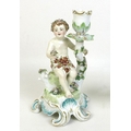 A Samson of Paris porcelain figural candlestick, after a Chelsea design, mid 19th century, modelled ... 