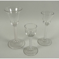 Two Georgian air twist wine glasses, one with flared bowl, 17.2cm high, the other with a rounded fun... 