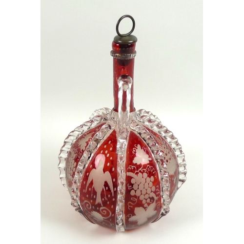 8 - A 19th century cranberry glass decanter, with twin handles, applied clear glass and wheel engraved d... 