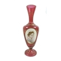 A 19th century Continental cranberry glass vase, of baluster form on circular foot, decorated with a... 
