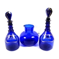 A pair of William IV blue glass decanters, with gilt painted labels, inscribed Rum and Holland (gin)... 