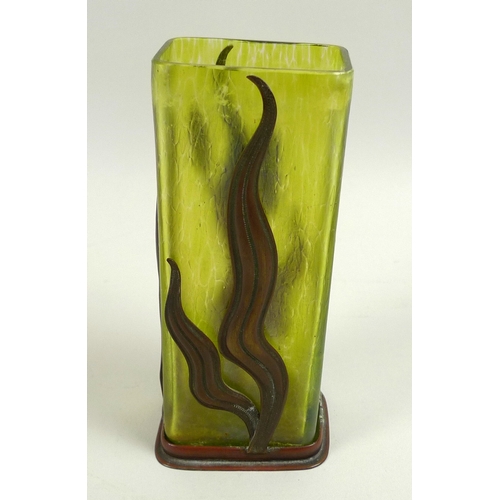 10 - An Art Nouveau iridescent green glass and metal vase, in the style of Loetz, the rectangular section... 