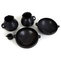 Five pieces of Chinese Longshan style black pottery, comprising two twin handled tea bowls, two sing... 