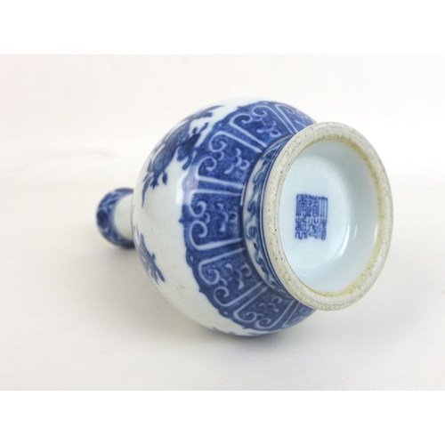 83 - A Chinese porcelain Ming style garlic mouth vase, decorated in heaped and piled style underglaze blu... 