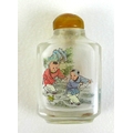 A 20th century Chinese miniature glass snuff bottle, with hand painted decoration featuring two youn... 