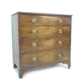 A 19th century chest of four graduating drawers,  mahogany veneered over pine, with oval brass plate... 