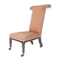 A Victorian mahogany and rosewood prie dieu chair, upholstered in pink cotton with rope twist edging... 